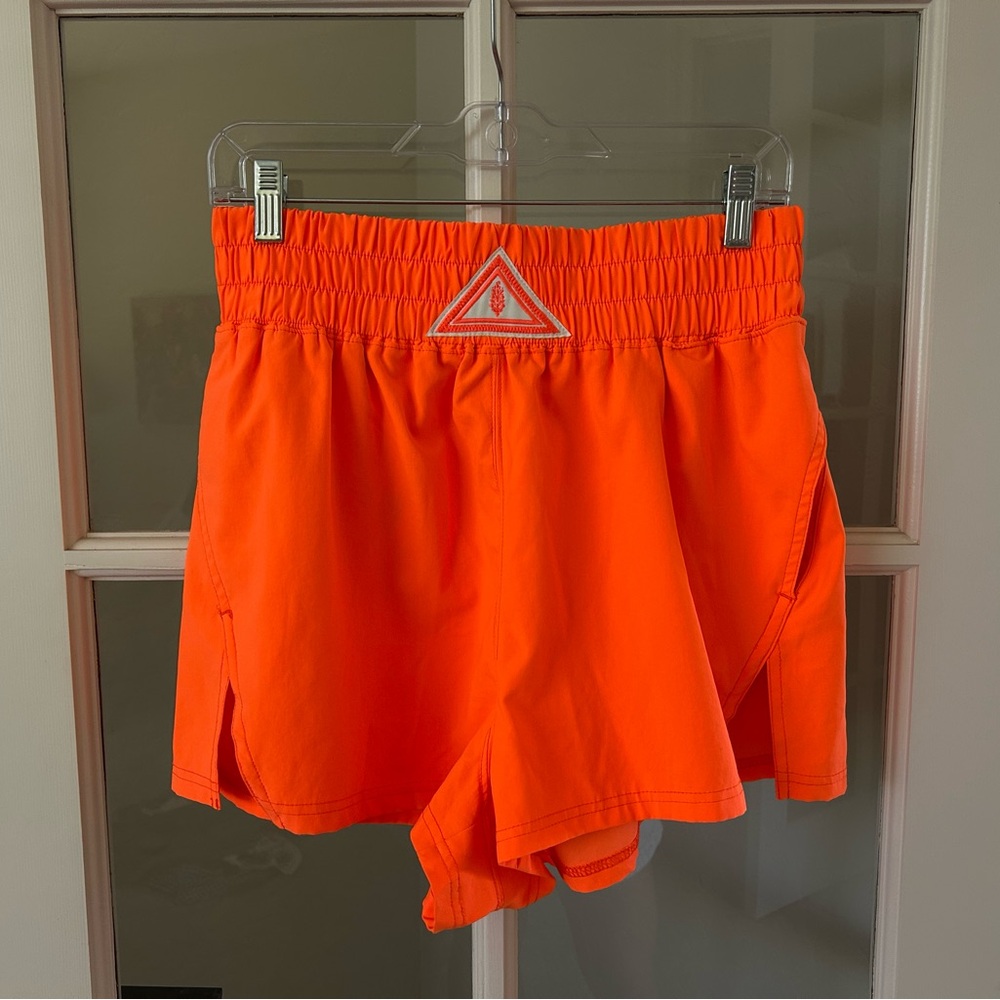 FP MOVEMENT BY FREE PEOPLE Next Round Shorts in Neon Orange